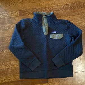 Small black and green Patagonia button sweatshirt